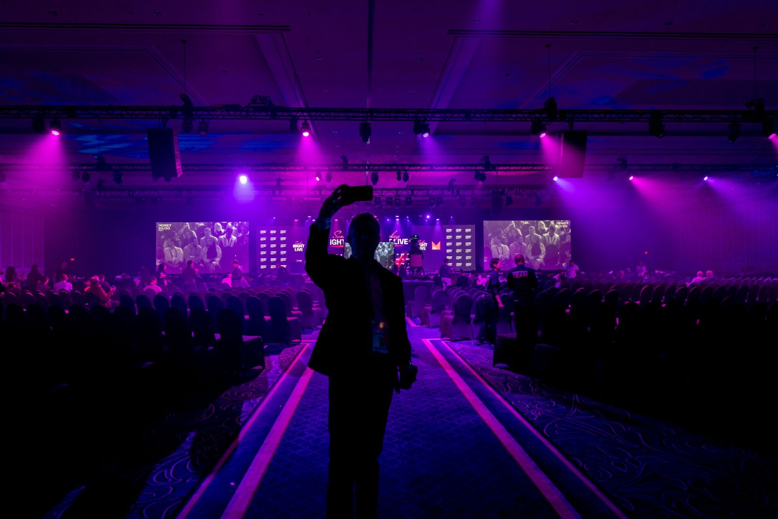 Money 20/20 USA keynote hall in purple and pink stage lighting